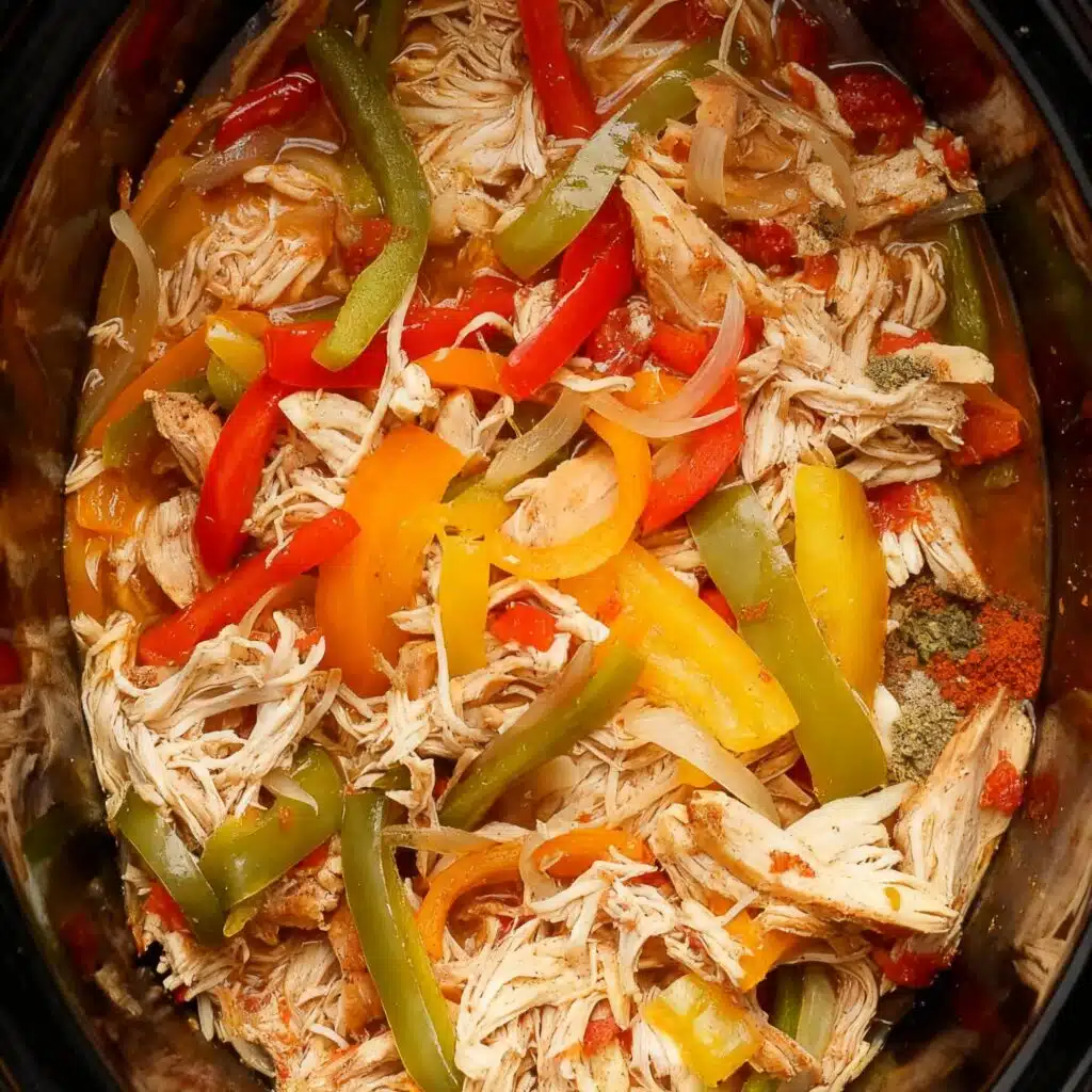 Crockpot Meals for Diabetics (Slow Cooker) 41 Sliced chicken and bell peppers in a vibrant mix of spices, sizzling hot in a slow-cooked fajita blend.