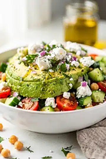 Chickpea Feta Avocado Salad 13 Creamy chickpea feta avocado salad recipe in a rustic white bowl