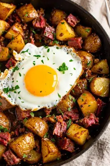 Corned Beef Hash Skillet 11 Corned beef hash skillet with crispy potatoes and a fried egg.