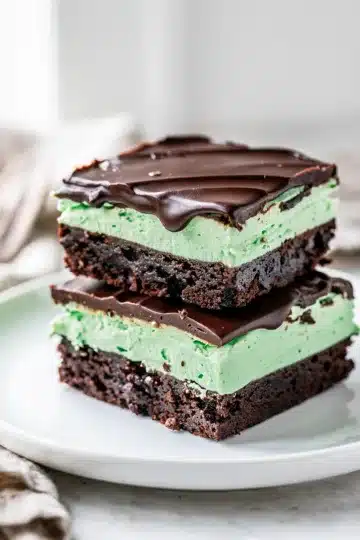 Mint Chocolate Brownies 10 Close up of fudgy mint chocolate brownies with creamy mint and glossy ganache topping