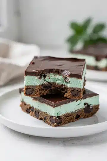 Mint Chocolate Cookie Bars 14 Layered mint chocolate cookie bars with creamy filling and glossy chocolate topping.