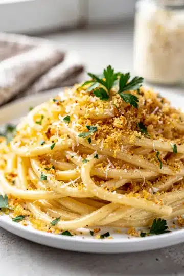 Garlic Parmesan Pasta 11 Creamy garlic parmesan pasta with crispy breadcrumbs and fresh parsley garnish.