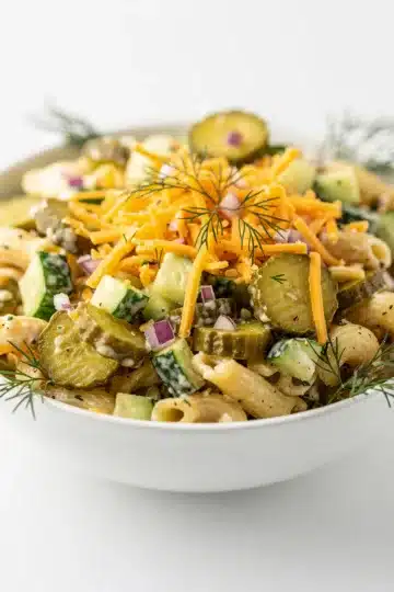 Dill Pickle Pasta Salad 11 Creamy dill pickle pasta salad with rotini, cheddar, and fresh herbs.