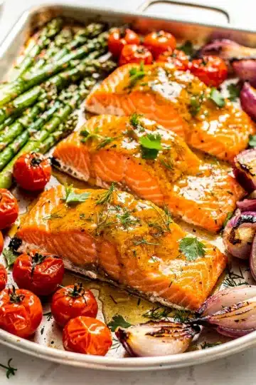 Honey Mustard Sheet Pan Salmon 13 Close up of honey mustard glazed salmon with roasted asparagus and tomatoes