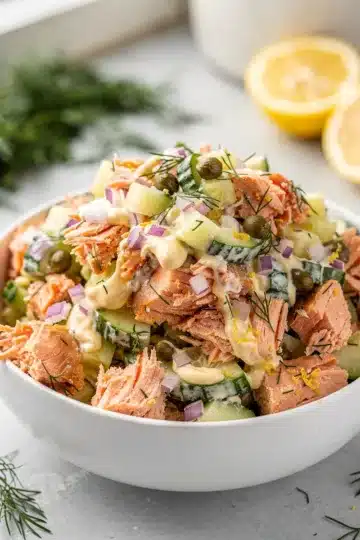 Lemon Dill Salmon Salad 11 Lemon dill salmon salad recipe with creamy dressing and fresh vegetables in a bowl.