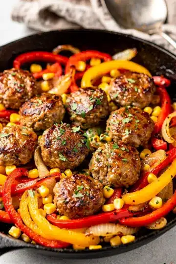 One Pan Sausage and Peppers 14 One pan sausage and peppers with sweet corn in a rustic skillet