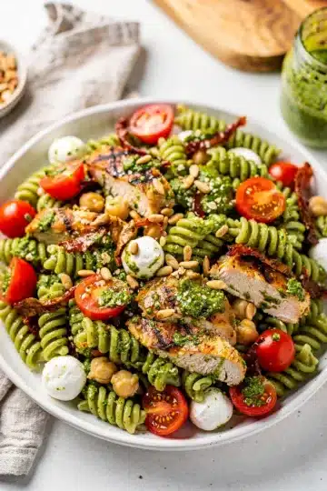 Pesto Chicken Pasta Salad 9 Creamy pesto chicken pasta salad with tomatoes chickpeas and mozzarella pearls