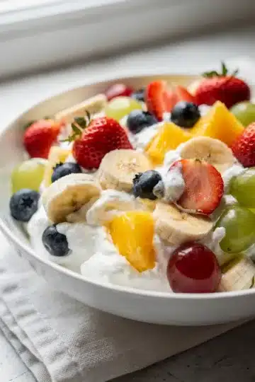Vanilla Pudding Fruit Salad 12 Creamy vanilla pudding fruit salad with vibrant berries and banana slices