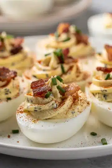 Classic Bacon Ranch Deviled Eggs 11 Classic bacon ranch deviled eggs with creamy filling and crispy bacon garnish