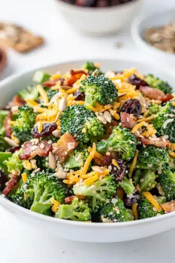 Chopped Broccoli Bacon Salad 11 Chopped broccoli bacon salad with cranberries and cheese in creamy dressing