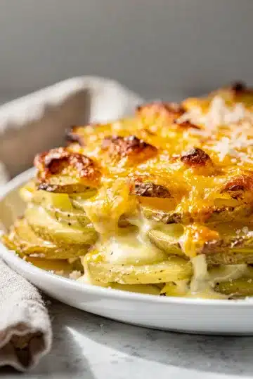 Cheesy Garlic Parmesan Scalloped Potatoes 2 Creamy cheesy garlic parmesan scalloped potatoes with a golden crispy topping.