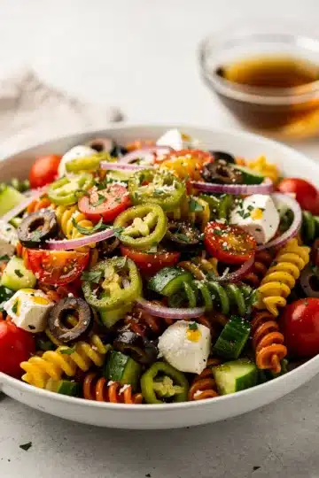 Classic Italian Pasta Salad 11 Colorful Italian pasta salad with rotini, tomatoes, peppers, and homemade dressing.