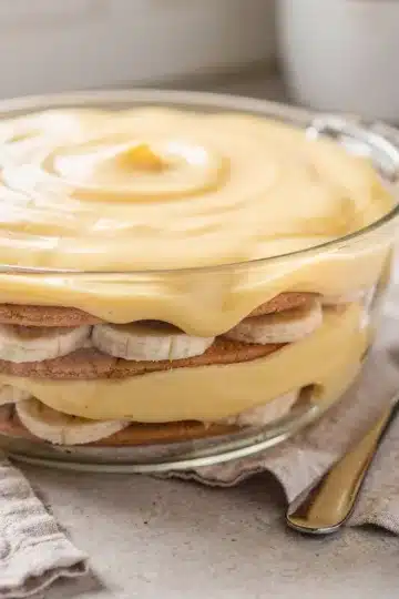 Creamy Banana Pudding 13 Creamy banana pudding in a glass bowl with soft vanilla wafer layers.