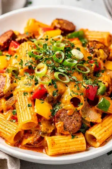 Cheesy Creamy Cajun Sausage Pasta 3 Creamy Cajun sausage pasta with penne in a glossy cheese sauce.