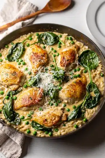 Creamy Chicken and Rice Skillet 12 Creamy chicken and rice skillet with parmesan sauce and green vegetables