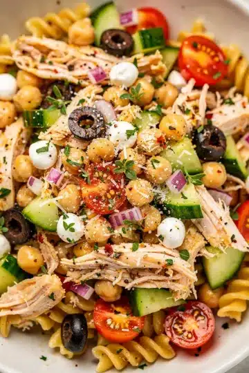 Fresh High Protein Italian Pasta Salad 11 Fresh high protein Italian pasta salad with creamy mozzarella and glossy dressing.