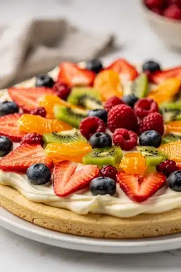 No Bake Sugar Cookie Fruit Pizza 11 Colorful fresh fruit pizza on sugar cookie crust with cream cheese frosting