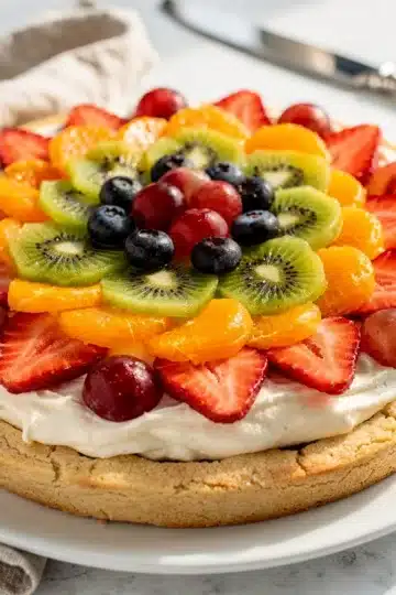 Classic Sugar Cookie Fruit Pizza 12 Colorful fresh fruit pizza with creamy frosting on a soft sugar cookie crust.