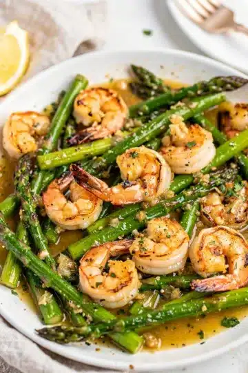 Garlic Butter Shrimp Asparagus Skillet 4 Garlic butter shrimp and asparagus skillet with creamy sauce close up
