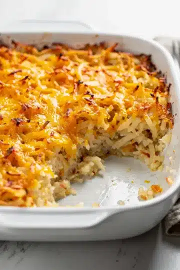 Homestyle Crockpot Cheesy Hashbrown Casserole 14 Creamy crockpot cheesy hashbrown casserole with golden melted cheese topping.