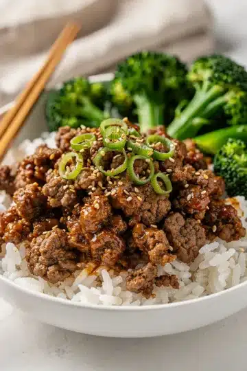 Classic Korean Ground Beef Bowl 11 Classic Korean ground beef bowl with glossy sauce over fluffy white rice.