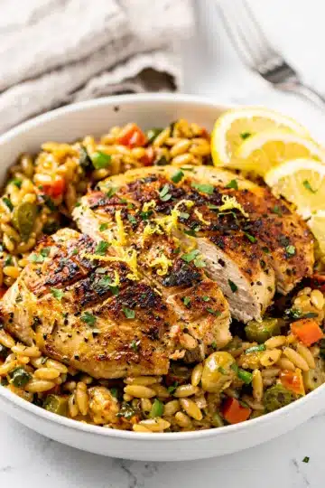 Lemon Herb Chicken Orzo Skillet 5 Creamy lemon herb chicken orzo skillet with golden seared chicken pieces
