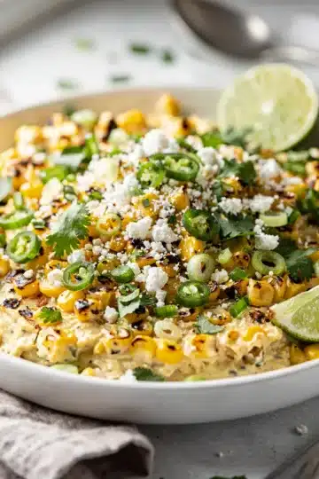 Loaded Mexican Street Corn Dip 11 Creamy loaded Mexican street corn dip with cotija cheese and tortilla chips.