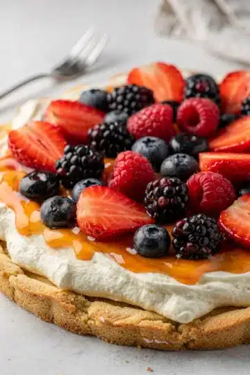 No Bake Berry Cheesecake Fruit Pizza 11 Colorful berry fruit pizza on sugar cookie crust with creamy cheesecake filling.