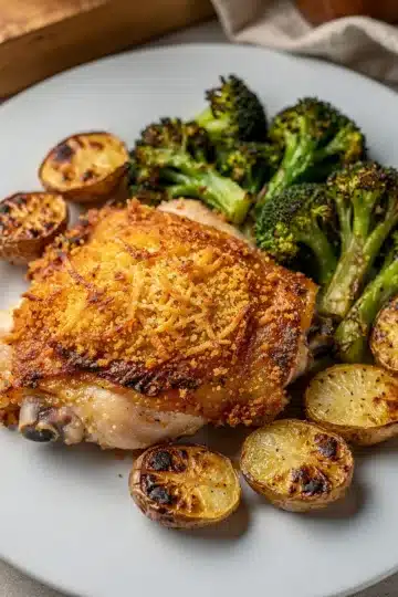 Homestyle Parmesan Crusted Sheet Pan Chicken Dinner 11 Crispy Parmesan crusted chicken with roasted potatoes and broccoli dinner.