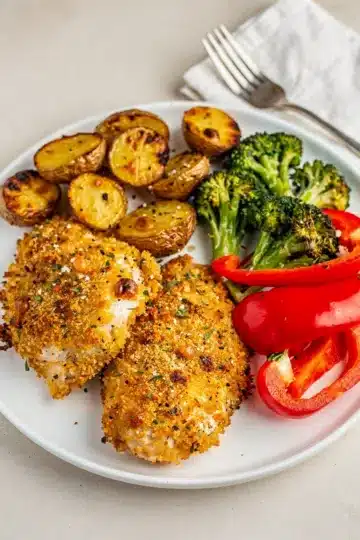 Easy Parmesan Crusted Sheet Pan Chicken Dinner 11 Easy parmesan crusted sheet pan chicken with roasted potatoes and broccoli dinner.