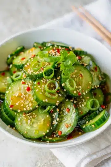 Easy Spicy Asian Cucumber Salad 12 Spicy Asian cucumber salad recipe with chili crisp and sesame seeds.