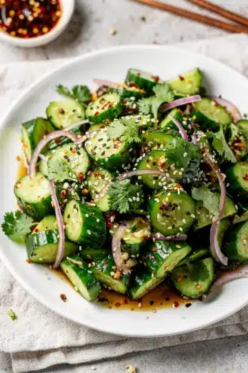 Chopped Spicy Asian Cucumber Salad 11 Spicy Asian cucumber salad with chili sesame dressing and toasted sesame seeds