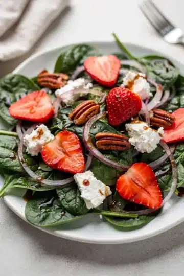 Strawberry Goat Cheese Spinach Salad 13 Strawberry goat cheese spinach salad with pecans and balsamic vinaigrette.