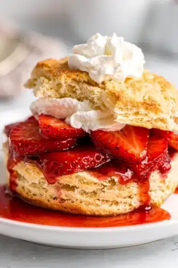Easy Strawberry Shortcake 12 Golden brown buttery biscuit topped with fresh strawberries and vanilla whipped cream.
