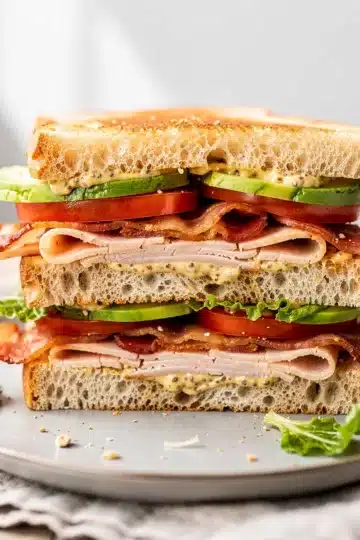 No Cook Turkey Club Sandwich 11 No cook turkey club sandwich with avocado and bacon on sourdough bread