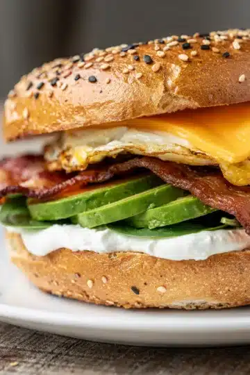 High Protein Bagel Egg Sandwich 14 High protein bagel egg sandwich with avocado bacon and melted cheese