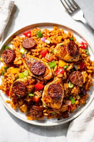 Cajun Chicken and Andouille Sausage Jambalaya 13 Cajun chicken and andouille jambalaya in rustic cast iron skillet