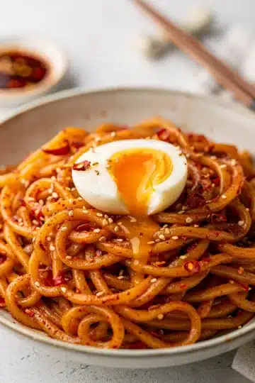 Chili Oil Sesame Noodles with Soft Boiled Egg 12 Chili oil sesame noodles with soft boiled egg close up.