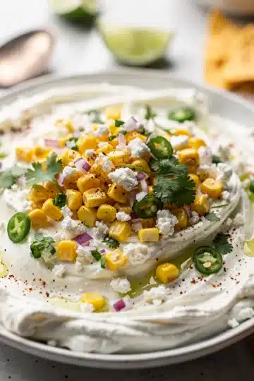 Chilled Street Corn Dip 11 Creamy chilled street corn dip with cotija cheese in a rustic bowl.