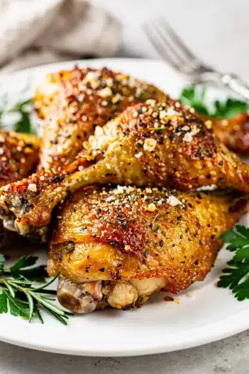 Crispy Herb Baked Chicken Legs 13 Crispy herb baked chicken legs with golden parmesan crust and lemon.