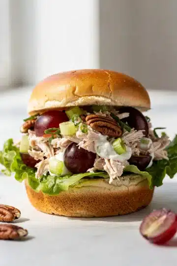 Crunchy Pecan Grape Chicken Salad Slider 11 Close up of crunchy pecan grape chicken salad slider on wooden board