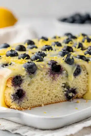 Lemon Blueberry Sheet Cake 14 Lemon blueberry sheet cake with creamy glaze and tender crumb close up