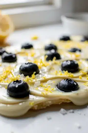 Lemon Blueberry White Chocolate Bark 11 Lemon Blueberry White Chocolate Bark with fresh blueberries and zest.