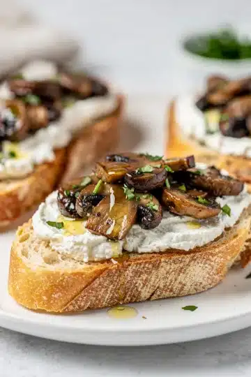 Mushroom Goat Cheese Bruschetta 11 Creamy goat cheese and sautéed mushroom bruschetta on rustic toasted baguette slices.