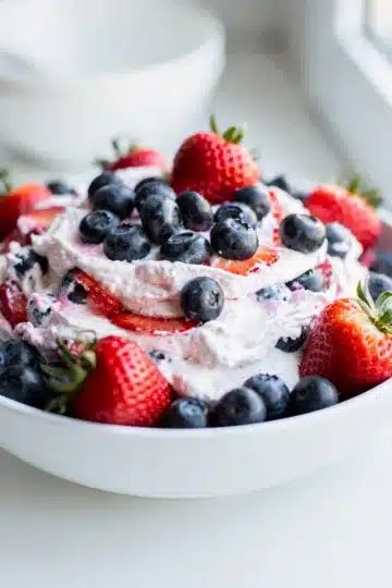 Red White and Blue Berry Cheesecake Dip 11 Creamy cheesecake dip with fresh strawberries and blueberries for July Fourth.