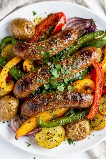Sausage and Veggie Bell Pepper Sheet Pan Bake 14 Sausage and veggie bell pepper sheet pan bake with roasted potatoes and herbs.