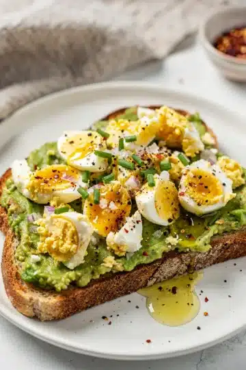 Smashed Egg Avocado Toast 11 Smashed avocado and egg toast recipe with creamy textures and vibrant colors.