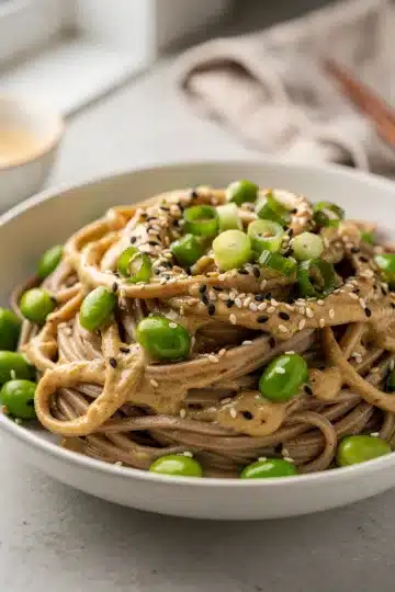 Tahini Sesame Soba Noodles with Edamame 12 Tahini Sesame Soba Noodles with Edamame creamy glossy bowl.