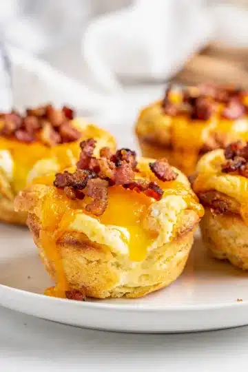 Turkey Bacon Egg Muffin Cups 11 Golden brown turkey bacon egg muffin cups with cheese and bell peppers.