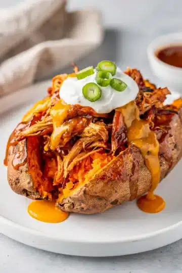 BBQ Chicken Stuffed Sweet Potatoes 12 BBQ chicken stuffed sweet potatoes with melted cheddar cheese.